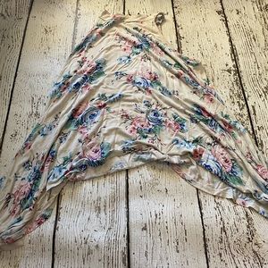 really cute blouse. the sides drape down longer than the front or back